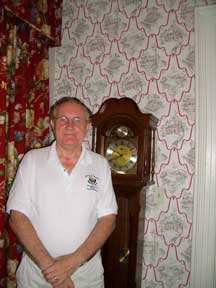 Bob Woltz standing by the new wallpaper at the Truman Little White House.